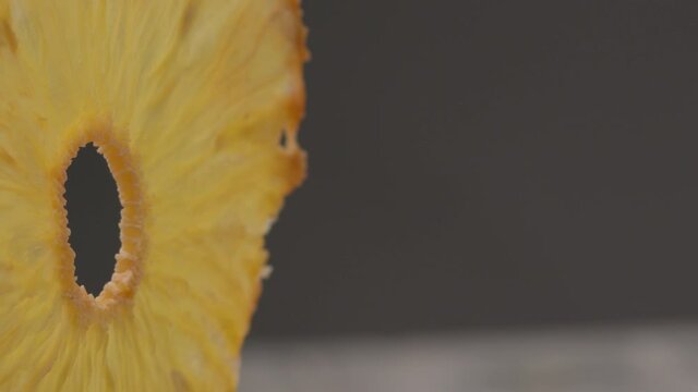 Dried pineapple. Dried pineapples on the table. Dried pineapples on the table.  Rotating Dried Pineapple rings seamless loopable. Dried Pineapple rings seamless. Fresh made Dried Pineapple rings. 
