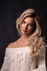 Blonde, studio portrait of a young girl