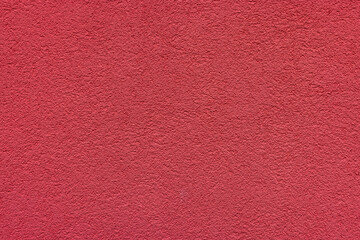 Red plaster facade texture background. External facade of the building, plaster with clear texture.