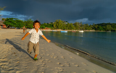 child playing on the beach