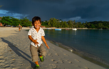 child playing on the beach
