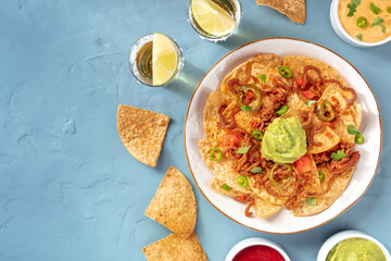 Nachos plate with tequila shots and a place for text