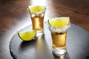 Tequila shots with salt rims and lime slices