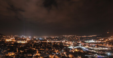 Night panorama over the city of Tbilisi in Georgia, looking from the Narikala Fortress on a summer night. © Anze