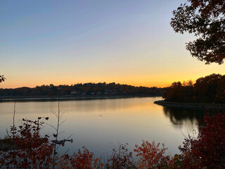Naklejka na ściany i meble sunset over a still lake