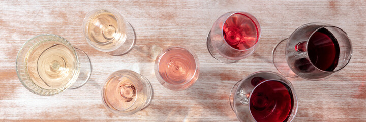 Wine color panorama with many different glasses, a flat lay