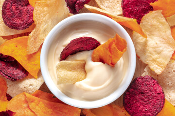 Vegetable chips with a dip close-up shot