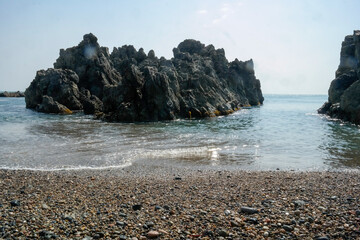 Fototapeta na wymiar Tough rocks island on the sea