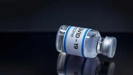 Close up Vaccine and syringe injection, treatment to cure Covid 19 Coronavirus. , Its uses for prevention, immunization, and treatment, Medical concept, isolated on black background