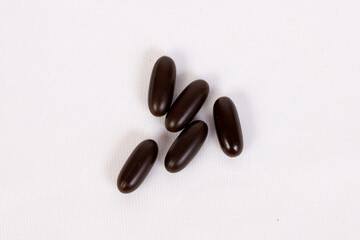 The multivitamin pills in brown colour