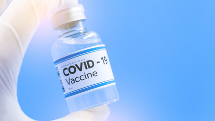 Close up Vaccine concept in the hand of doctor white vaccine jar with copy space. Vaccine Concept of the fight against coronavirus, immunization, and treatment, medical concept, 