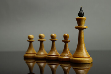 chess leadership concept on the grey background