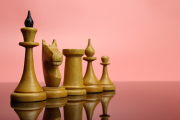Vintage wooden chess pieces, business leadership concept