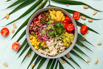 Organic hawaiian chicken poke bowl with rice and vegetables