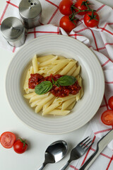 Concept of tasty food with pasta with tomato sauce on white background