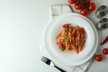 Concept of tasty food with pasta with tomato sauce on white background