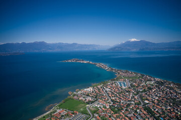 Sirmione winter aerial view. High altitude panorama of Sirmione city, Colombare, Italy. Aerial panorama of Lake Garda. Italian resorts Lake Garda aerial view.