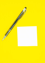 Blank white To Do List Sticker with pen. Searching information on the Internet..Close up of reminder note paper on the yellow background. Copy space. Minimalism, original and creative.