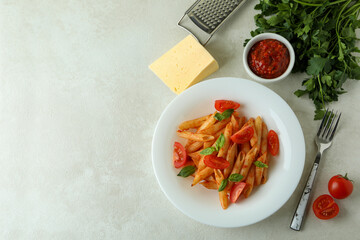 Concept of tasty food with pasta with tomato sauce and ingredients
