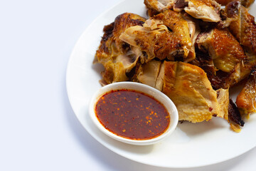 Grilled chicken with spicy sauce on white