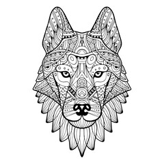 Patterned head of a wolf, husky, dog monochrome. Abstract ethnic image of the head of a wolf with tribal ornament. The ornament is painted by hand. A series of animals in the ethnic style.