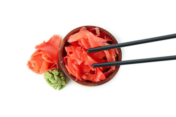 Bowl with pickled ginger, wasabi and chopsticks isolated on white background