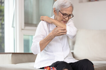 Itchy senior woman is scratching her arm causes of itching from mosquitoes,insect bites or dry...
