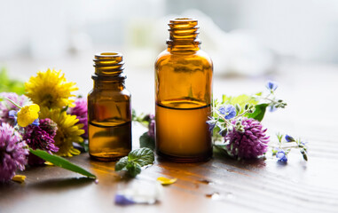 Fototapeta na wymiar Aromatherapy essential oil bottles, herbal plants and oil