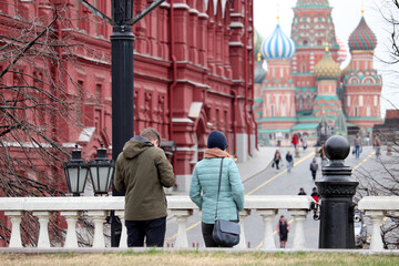 View to the Red square, State historical museum and St. Basil's Cathedral in Moscow. Tourists admire the sights of Russia in the spring