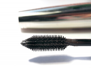 Close-up of mascara brush on white background.  Beauty concept.