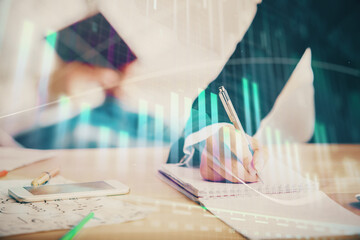 Double exposure of forex chart drawing over people taking notes background. Concept of financial...