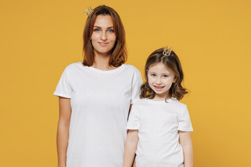 Happy woman in basic white t-shirt diadem have fun with cute child baby girl 5-6 years old Mom...
