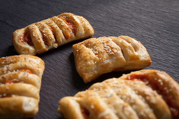 cooking baking confectionery oven puffs dough sausage in dough black background
