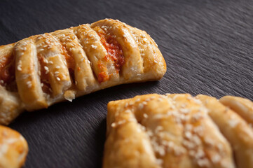 cooking baking confectionery oven puffs dough sausage in dough black background