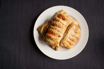 cooking baking confectionery oven puffs dough sausage in dough black background