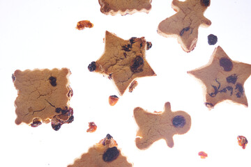 Cookies in different shapes, gluten-free, lactose-free, healthy dessert with dark chocolate and raisins on an isolated white background, levitation