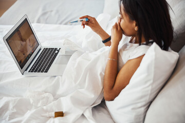 Young woman with flu having online consultation with doctor