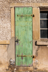old green door in an old fabric in Switzerland