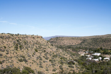 Fototapeta na wymiar View of distant farmhouse in the Karoo South Africa