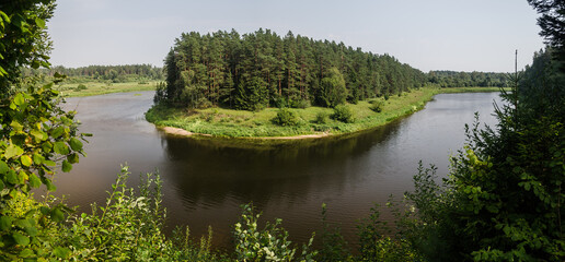 Beautiful river bend and forests on a sunny summer day.