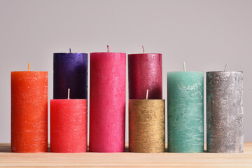 Set of different color candles with a rough texture for a modern interior