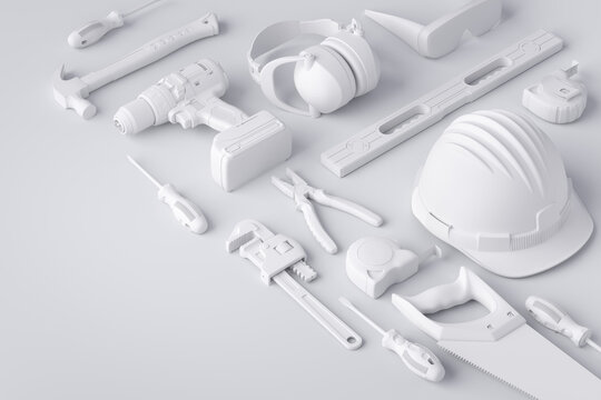 Top view of monochrome construction tools for repair and installation on white