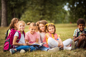 Group of school kids learning together.