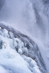 arctic landscape of frozen water from a waterfall in the mountains