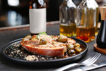 Baked eggplant steak with Brussels sprouts.
Culinary photography. Suggestion to serve the dish.