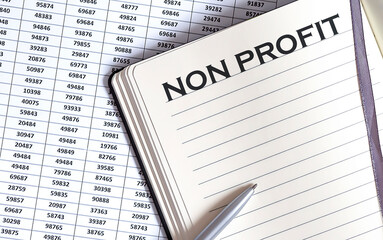 Obraz premium Business concept, on the table a notepad with the text of the NON PROFIT