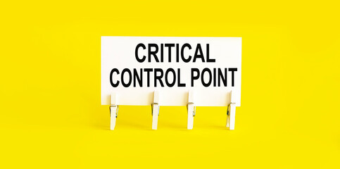 text CRITICAL CONTROL POINT on the white short note paper yellow background