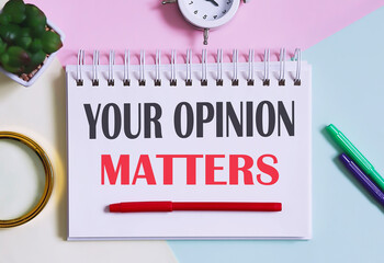 YOUR OPINION MATTERS text written on a notebook with pencils, magnifier
