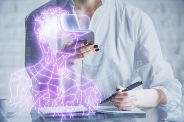 Double exposure of man in vr glasses sketch hologram and woman holding and using a mobile device.