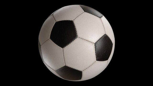 Rotating soccer ball isolated on black background. Sports football. Alpha channel 3d illustration